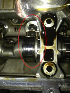 This is a picture of the cam shaft. The part in red is where the damage is